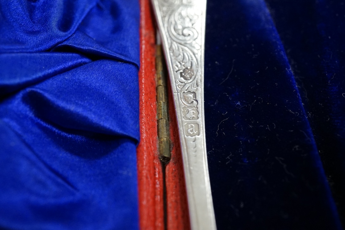 Three assorted silver christening sets including spoon, fork and napkin ring by William Hutton & Sons, London, 1896, one other set with steel knife, two cased sets of silver coffee spoons and a cased set of six Japanese